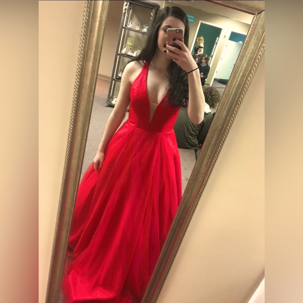 Red Sherrill Hill prom dress size 6 but was altered to fit a size 2-4.